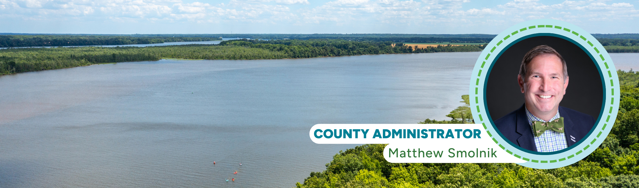 Aerial photo of the Rappahannock River in King George with image in corner of county administrator